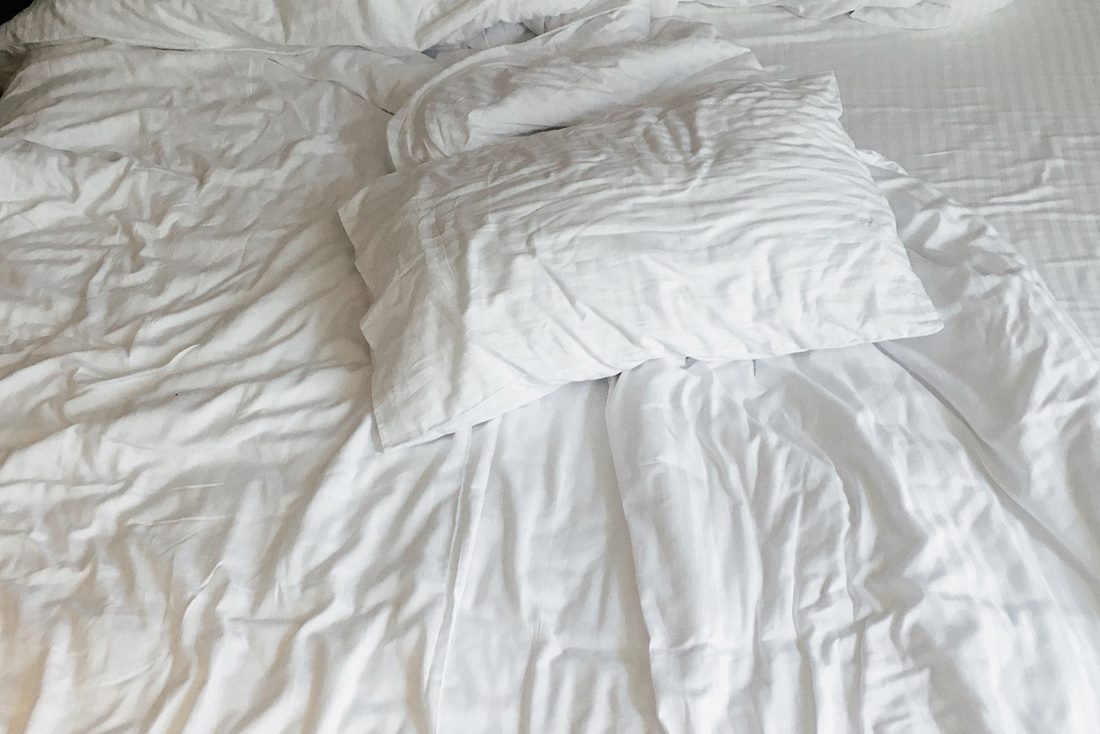 LANE LINEN white cotton sheets on a sunlit bed