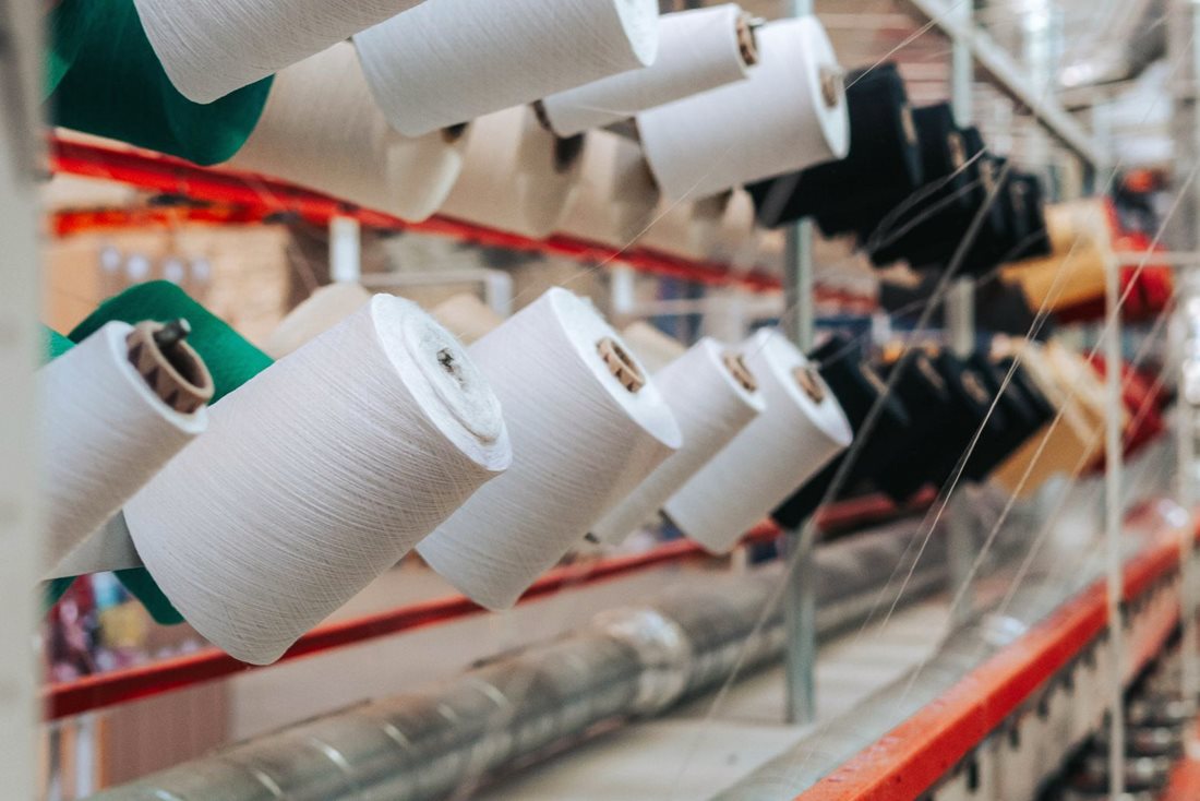 Long-staple cotton yarn on spools