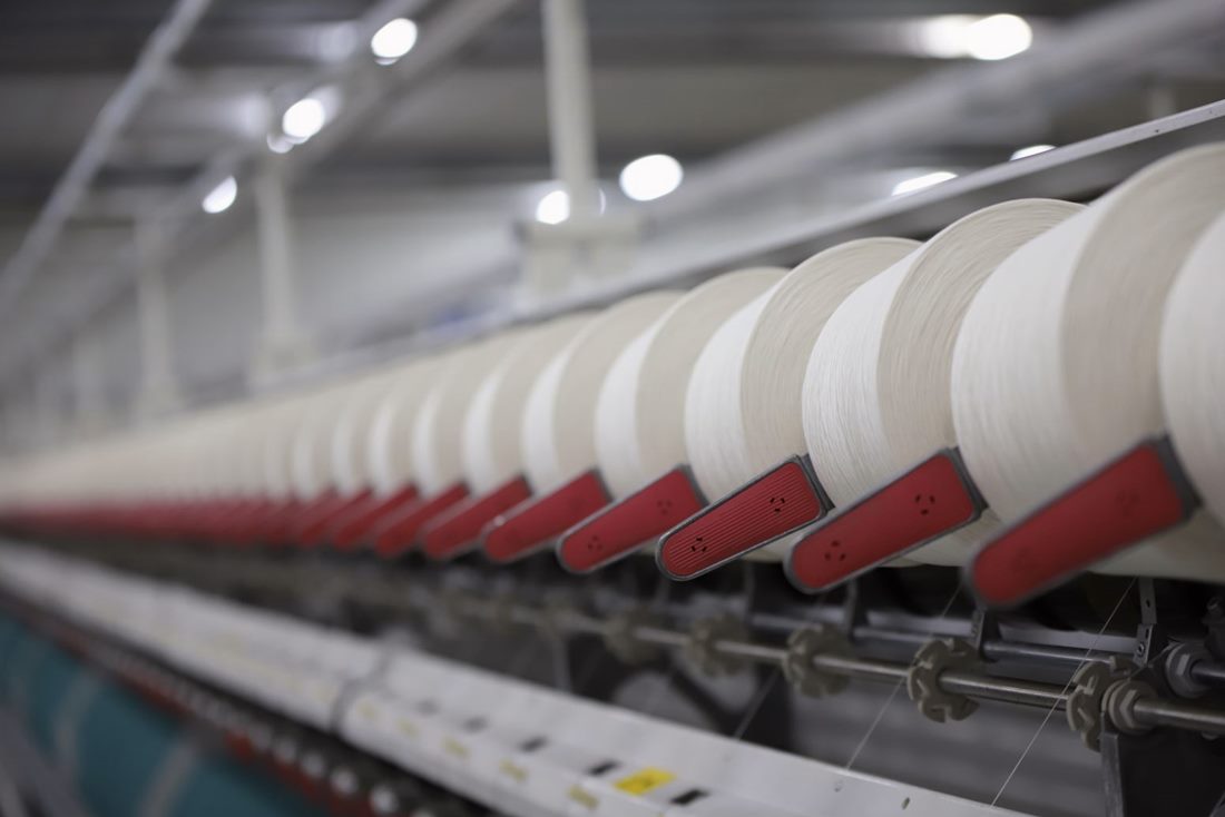 Finished cotton fabric being inspected